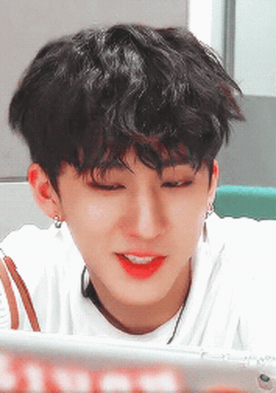 A Close Up Of A Person 'S Face With A White Shirt On GIF