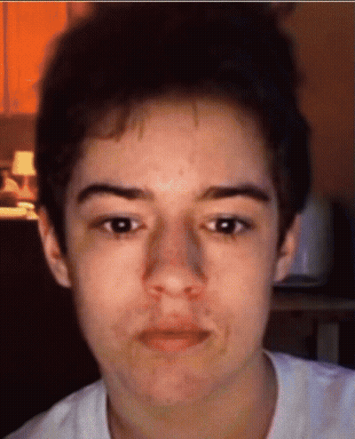 A Close Up Of A Person 'S Face With A White Shirt GIF