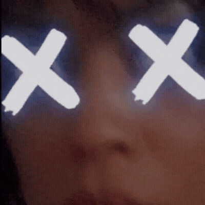 A Close Up Of A Person 'S Face With A White X On Their Eyes GIF