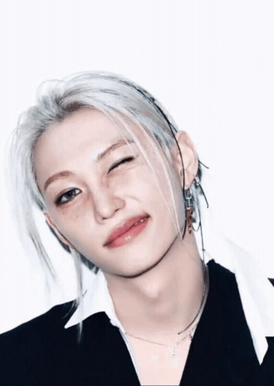 A Close Up Of A Person 'S Face With A Wink On Their Face GIF