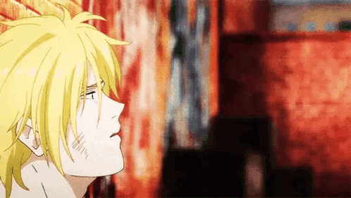 A Close Up Of A Person 'S Face With A Yellow Haired Anime Character . GIF