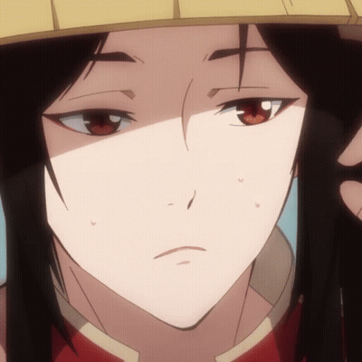 A Close Up Of A Person 'S Face With A Yellow Hat On GIF