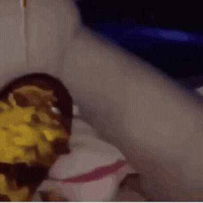 A Close Up Of A Person 'S Face With A Yellow Sauce On It GIF