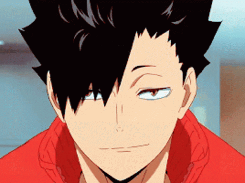 A Close Up Of A Person 'S Face With Black Hair And A Red Shirt . GIF