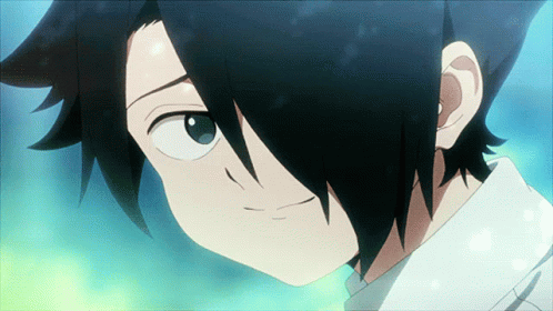 A Close Up Of A Person 'S Face With Black Hair And Blue Eyes GIF