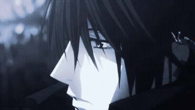 A Close Up Of A Person 'S Face With Black Hair And Blue Eyes GIF