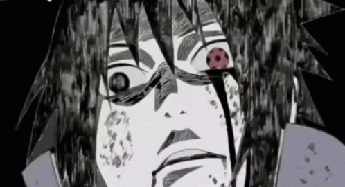 A Close Up Of A Person 'S Face With Blood Coming Out Of Their Eyes . GIF