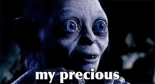 A Close Up Of A Person 'S Face With Blue Eyes And The Words `` My Precious '' Written On It . GIF