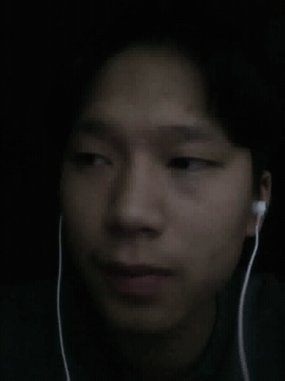 A Close Up Of A Person 'S Face With Ear Buds On GIF
