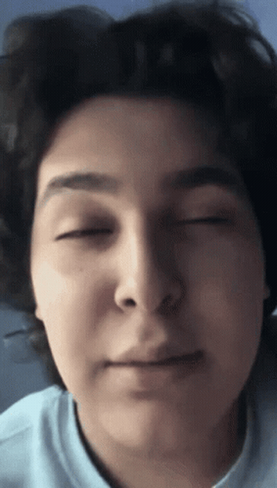 A Close Up Of A Person 'S Face With Eyes Closed GIF