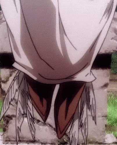 A Close Up Of A Person 'S Face With Feathers Coming Out Of It . GIF