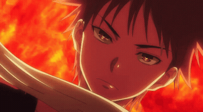 A Close Up Of A Person 'S Face With Fire Behind Them GIF