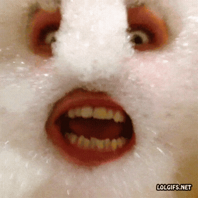 A Close Up Of A Person 'S Face With Foam Coming Out Of Their Mouth GIF