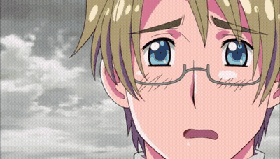 A Close Up Of A Person 'S Face With Glasses And Blue Eyes GIF