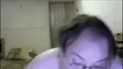 A Close Up Of A Person 'S Face With Glasses On . GIF