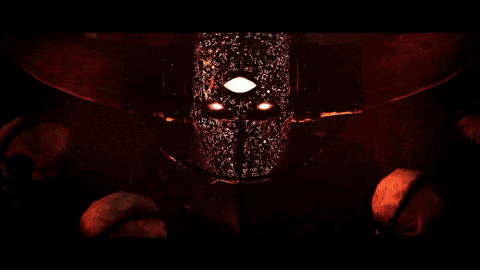 A Close Up Of A Person 'S Face With Glowing Eyes GIF