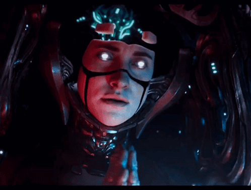 A Close Up Of A Person 'S Face With Glowing Eyes In A Dark Room GIF