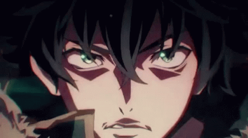 A Close Up Of A Person 'S Face With Green Eyes And A Beard . GIF