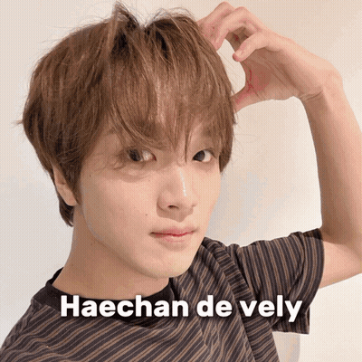A Close Up Of A Person 'S Face With Haechan De Vely Written On The Bottom GIF