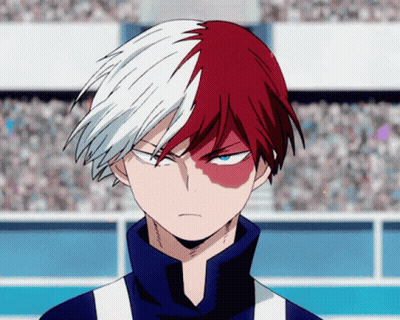 A Close Up Of A Person 'S Face With Half Red And Half White Hair GIF