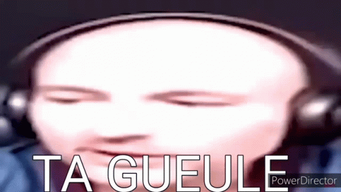 A Close Up Of A Person 'S Face With Headphones And The Words Ta Gueule Written Below It . GIF