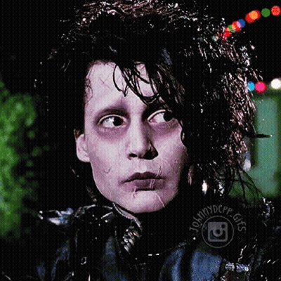 A Close Up Of A Person 'S Face With Johnnydepp Gifs Written Around His Neck GIF