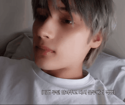 A Close Up Of A Person 'S Face With Korean Writing On The Bottom Right GIF