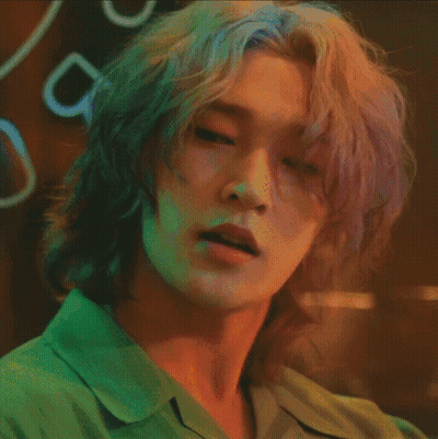 A Close Up Of A Person 'S Face With Long Hair GIF