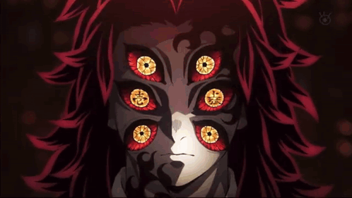 A Close Up Of A Person 'S Face With Many Eyes And Red Hair . GIF