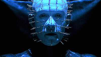 A Close Up Of A Person 'S Face With Nails In It 'S Head GIF