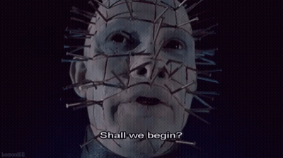 A Close Up Of A Person 'S Face With Nails On It And The Words `` Shall We Begin ? '' GIF