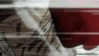 A Close Up Of A Person 'S Face With Nsnlxd Written On The Bottom Right GIF