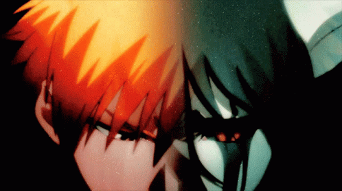 A Close Up Of A Person 'S Face With Orange Hair And A Black Face GIF