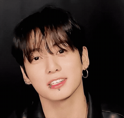 A Close Up Of A Person 'S Face With Piercings GIF