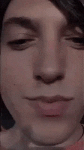 A Close Up Of A Person 'S Face With Pink Lips GIF