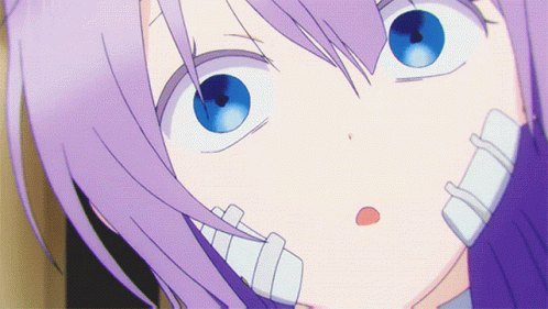 A Close Up Of A Person 'S Face With Purple Hair GIF