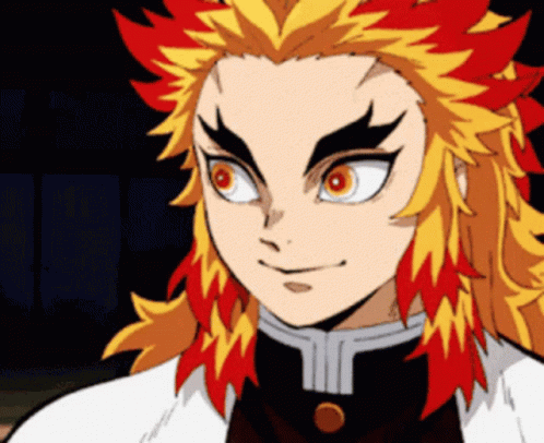 A Close Up Of A Person 'S Face With Red And Yellow Hair . GIF