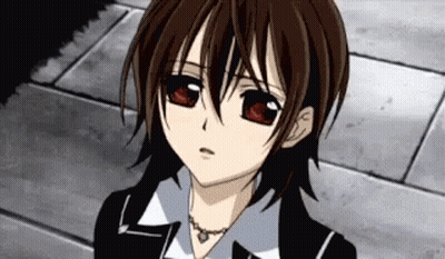 A Close Up Of A Person 'S Face With Red Eyes And A Necklace . GIF