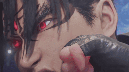 A Close Up Of A Person 'S Face With Red Eyes And Black Hair GIF