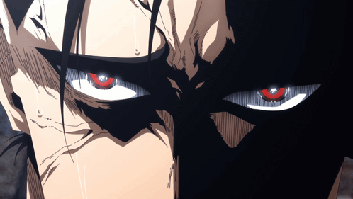 A Close Up Of A Person 'S Face With Red Eyes And Black Hair GIF