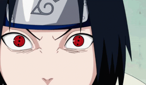 A Close Up Of A Person 'S Face With Red Eyes And The Letter G On Their Headband GIF