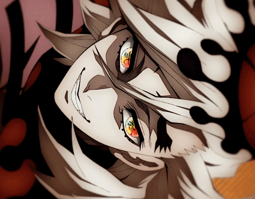 A Close Up Of A Person 'S Face With Red Eyes And White Hair GIF
