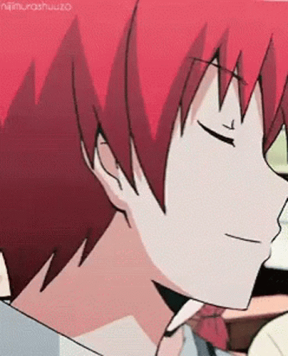A Close Up Of A Person 'S Face With Red Hair And Eyes Closed . GIF