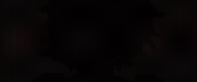 A Close Up Of A Person 'S Face With Red Hair And Purple Eyes GIF