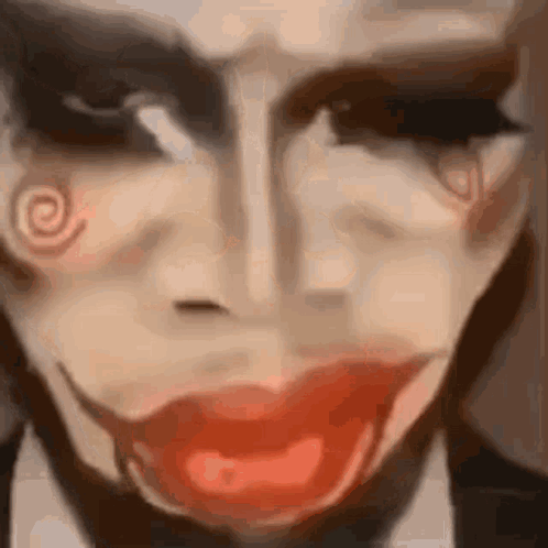 a close up of a person 's face with red lips and a spiral on it .