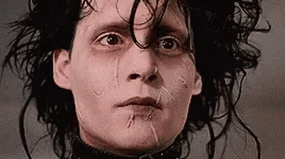 A Close Up Of A Person 'S Face With Tears Coming Out Of Their Eyes . GIF