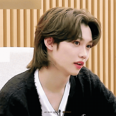 A Close Up Of A Person 'S Face With The Name Lee Felix On The Bottom Right GIF