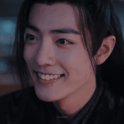 A Close Up Of A Person 'S Face With The Name Xiaotuzi Written On The Bottom GIF