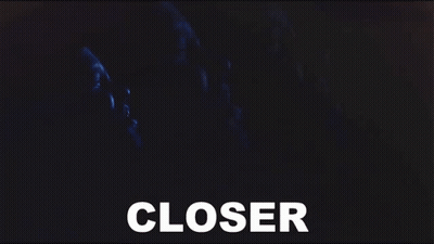 A Close Up Of A Person 'S Face With The Word Closer In White GIF