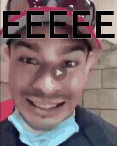 A Close Up Of A Person 'S Face With The Word Eeee Written Above It GIF